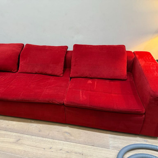Red sofa after professional upholstery cleaning
